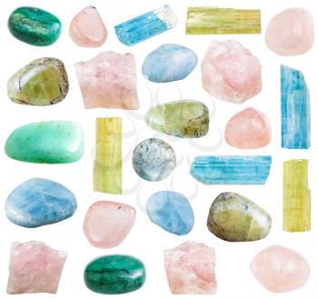 collection of tumbled and cristalline beryl mineral gemstones isolated on white background