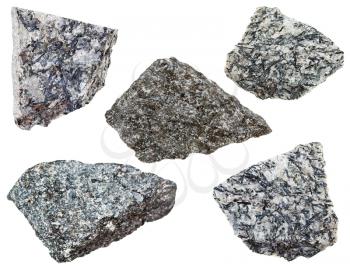 collection of various nepheline syenite mineral stones isolated on white background