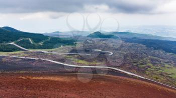 travel to Italy - road in hardened lava fields on Mount Etna in Sicily in summer day