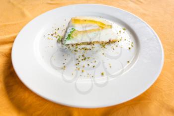travel to Italy, italian cuisine - traditional sicilian sweet cake cassata on white plate in Sicily