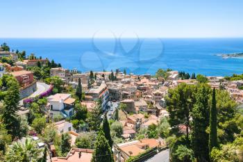 travel to Italy - above view of Taormina city from Castelmola village in Sicily in summer day