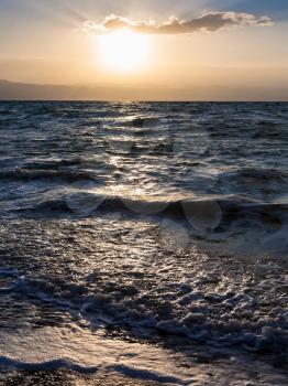 Travel to Middle East country Kingdom of Jordan - sunset and surf at Dead Sea in winter dusk