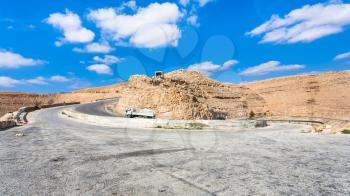 Travel to Middle East country Kingdom of Jordan - serpentine mountain road King's highway near Al Mujib dam in winter