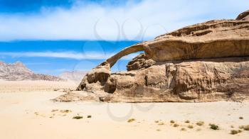 Travel to Middle East country Kingdom of Jordan - sandstone rock in Wadi Rum desert in sunny winter day
