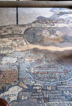 MADABA, JORDAN - FEBRUARY,20, 2012: pavement of Greek Orthodox St George Basilica in Madaba city with early Byzantine mosaic map of the Holy Land. The map was created in period between 542 and 570 AD
