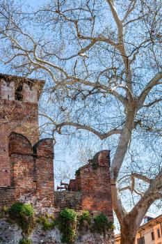 travel to Italy - view of wall with m-shaped merlons of Castelvecchio (Scaliger) Castel in Verona city in spring