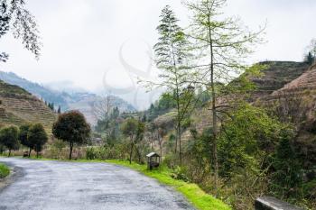 travel to China - road in area of Longsheng Rice Terraces (Dragon's Backbone terrace, Longji Rice Terraces) in spring season
