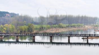 travel to China - above view of Manshui Bridge on Yi river in Longmen Grottoes area in spring season