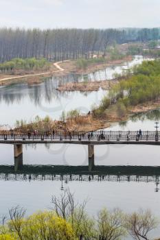 travel to China - above view of Manshui Bridge in valley of Yi river in Longmen Caves area in spring season