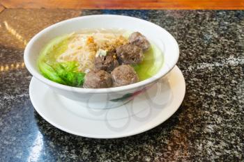 travel to China - meat balls with noodle soup in chinese cafe in Yangshuo town County