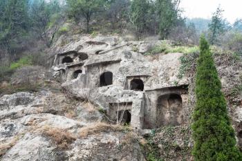LUOYANG, CHINA - MARCH 20, 2017: caves in West Hill of Chinese Buddhist monument Longmen Grottoes. The complex was inscribed upon the UNESCO World Heritage List in 2000