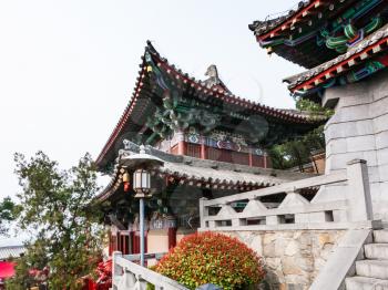 LUOYANG, CHINA - MARCH 20, 2017: pagoda of Xiangshan Temple on East Hill of Chinese Buddhist monument Longmen Grottoes in spring. The complex was inscribed upon the UNESCO World Heritage List in 2000