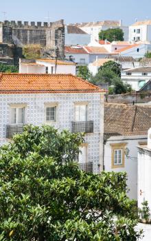 Travel to Algarve Portugal - view of residenial houses and Castle in Tavira city