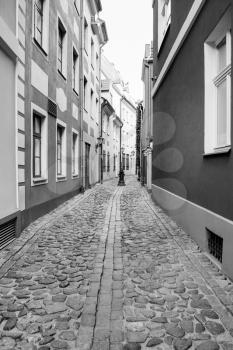 travel to Latvia - narrow street in Riga old town in autumn.