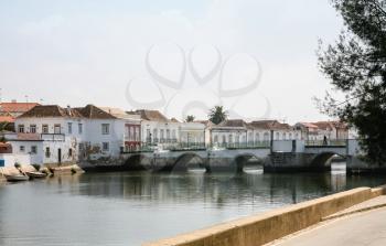 Travel to Algarve Portugal - view of medieval bridge over Gilao River in Tavira city