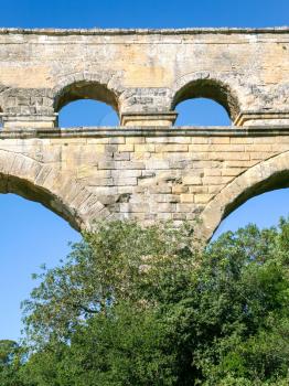 Travel to Provence, France - arch of ancient Roman aqueduct Pont du Gard near Vers-Pont-du-Gard town