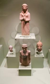 ATHENS, GREECE - SEPTEMBER 12, 2007: ancient figurines in Goulandris Museum of Cycladic Art. The museum was founded in 1986 in order to house the collection of Cycladic and Ancient Greek art