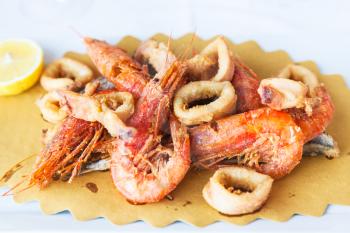 typical italian food - plate with fried local seafood in sicilian restaurant