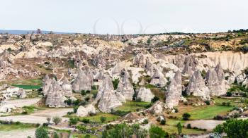 Travel to Turkey - panoramic view with rock houses in Goreme National Park in Cappadocia in spring