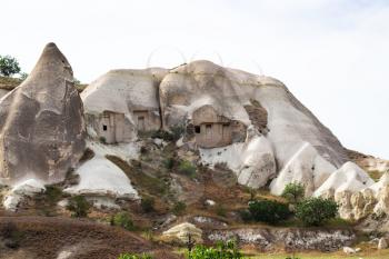 Travel to Turkey - cave houses in mountain slope in Goreme National Park in Cappadocia in spring