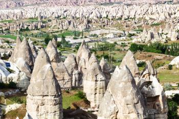 Travel to Turkey - above view of mountain valley with fairy chimney rocks in Goreme National Park in Cappadocia in spring