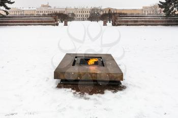 view of Eternal Flame memorial at Field of Mars (Marsovo Polye) in snowfall in Saint Petersburg city