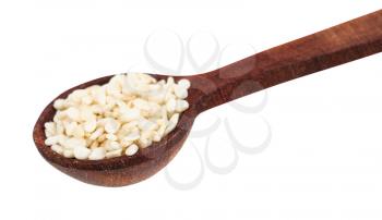 wooden spoon with portion of white sesame seeds close-up isolated on white background