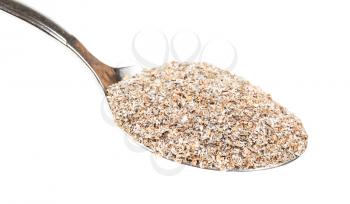 spoon with portion of rye bran close-up isolated on white background