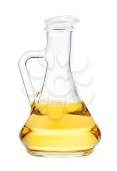 side view of glass jug with vegetable oil isolated on white background