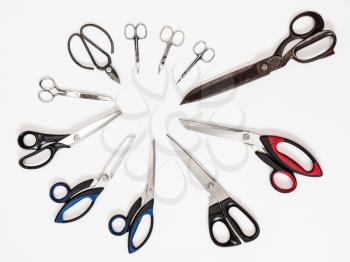 top view of circle from various scissors on white background