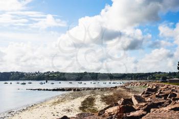 travel to France - stone Saint-Guirec beach of Perros-Guirec commune on Pink Granite Coast of Cotes-d'Armor department in the north of Brittany in sunny summer morning