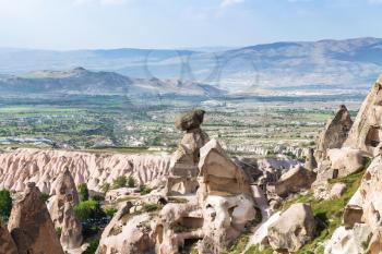 Travel to Turkey - fairy chimney rocks in Uchisar town and view of valley in in Cappadocia in spring