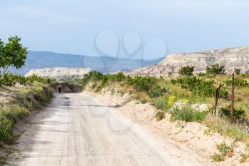 Travel to Turkey - country road in Goreme National Park in Cappadocia in sunny spring day