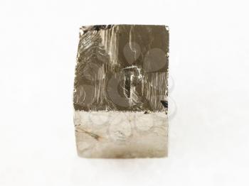 macro shooting of natural mineral rock specimen - rough pyrite crystal on white marble background from Spain