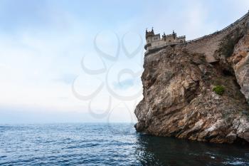 travel to Crimea - Swallow Nest Castle on Aurora Cliff of Ay Todor cape over Black Sea in evening