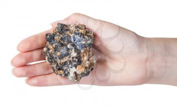 top view of zinc and lead mineral ore (sphalerite with galena) on female palm isolated on white background