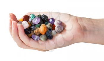 handful with various gems isolated on white background