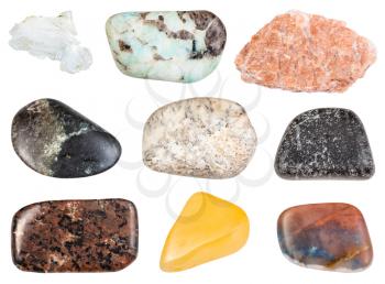 collection of natural mineral specimens - set of various tumbled stones (aventurine, albite, pegmatite, urtite, olivinite, dunite, chromite, irnimite, brucite) isolated on white