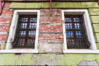 travel to Poland - shabby wall with windows of old house in Wroclaw city in september