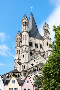 travel to Germany - tower of Great St Martin Church over Fish Market area in Old town of Cologne city in september