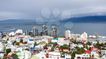 travel to Iceland - aerial view of Reykjavik city with port and Atlantic ocean coast from Hallgrimskirkja church in autumn