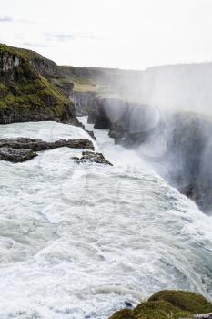 travel to Iceland - Gullfoss waterfall falls at the bottom of canyon of Olfusa river in september