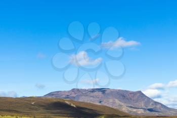 travel to Iceland - blue sky over mountain along Laugarvatnsvegur road near Efsti-Dalur village in Iceland in september
