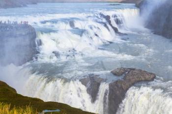 travel to Iceland - view of flow of Gullfoss waterfall from canyon edge in autumn