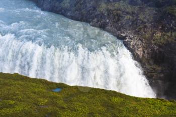 travel to Iceland - view of Gullfoss waterfall stream from canyon edge in autumn