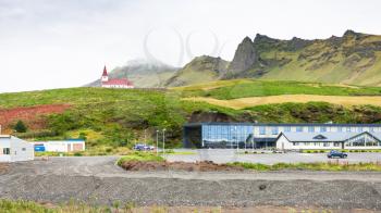 travel to Iceland - apartments and Reyniskirkja church in Vik I Myrdal village on Atlantic South Coast in Katla Geopark in september
