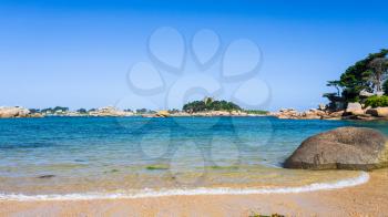 travel to France - view of Saint-Guirec beach of Perros-Guirec commune on Pink Granite Coast of Cotes-d'Armor department in the north of Brittany in sunny summer morning