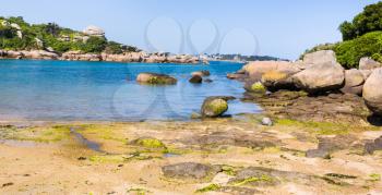 travel to France - part of Saint-Guirec beach of Perros-Guirec commune on Pink Granite Coast of Cotes-d'Armor department in the north of Brittany in sunny summer morning