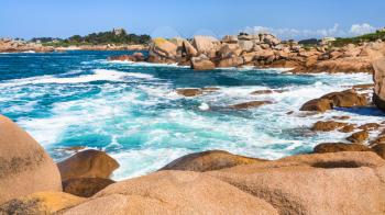 travel to France - stone shore of English Channel in Ploumanac'h site of Perros-Guirec commune on Pink Granite Coast of Cotes-d'Armor department in the north of Brittany in sunny summer day