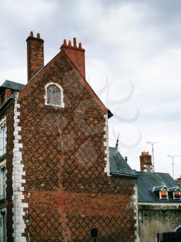 travel to France - old brick urban building in Orleans city in overcast day